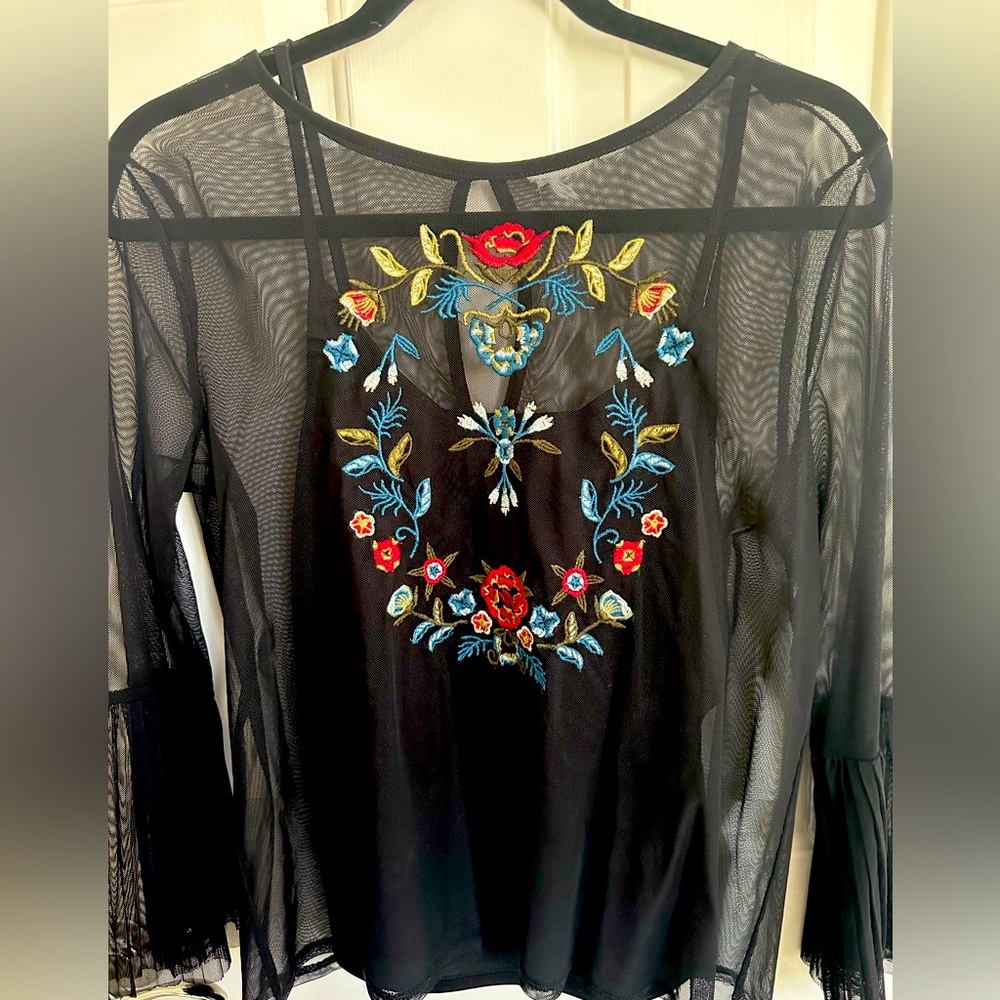 Sheer top with embroidered floral design